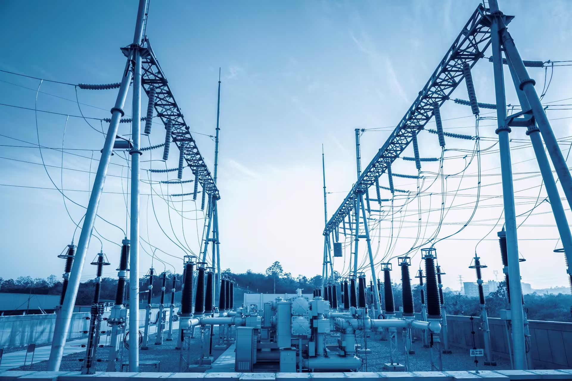 Three Janitza measuring devices mounted on a wall in a control room for energy data monitoring