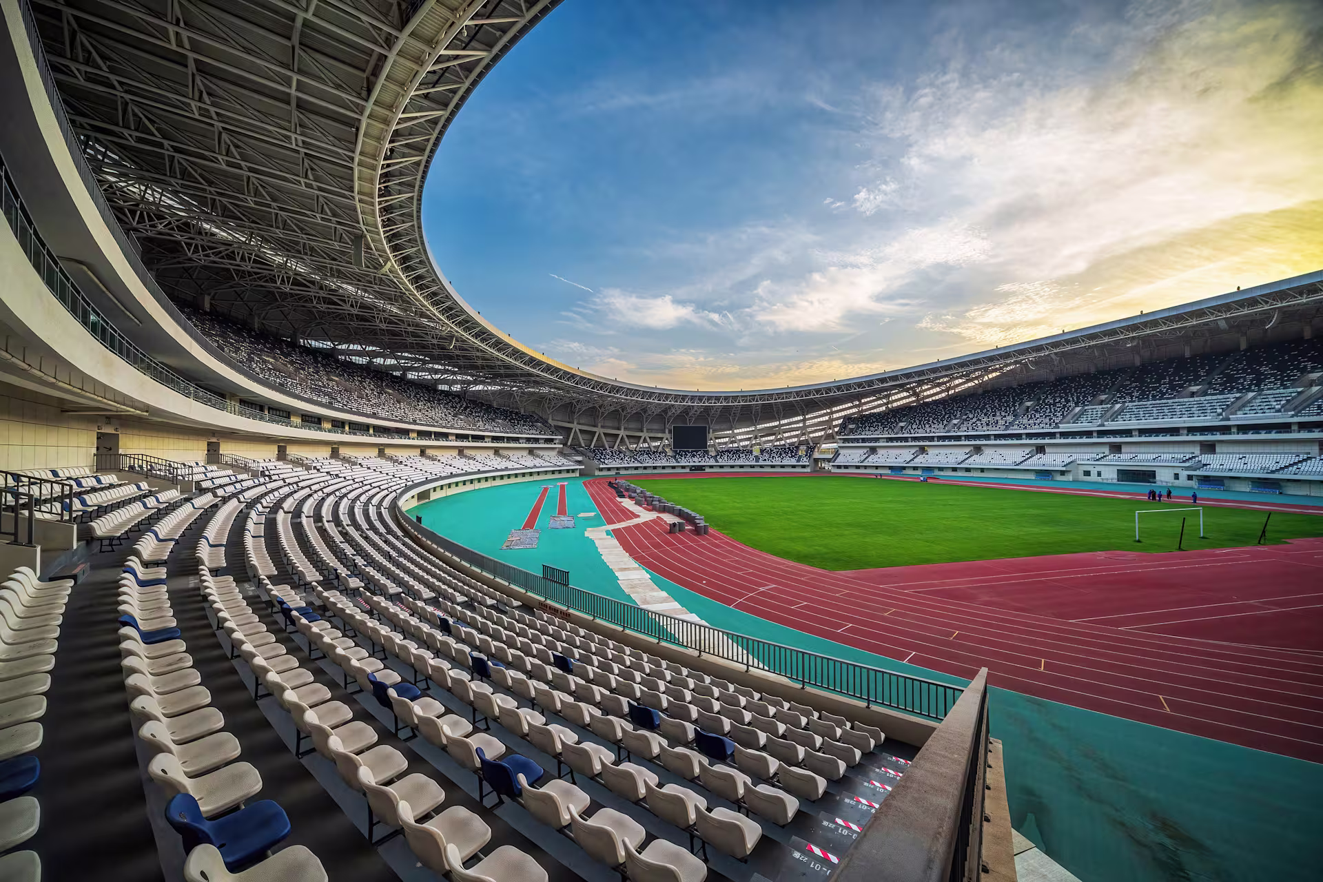 dusk-sky-modern-stadiums-curved-seating-field